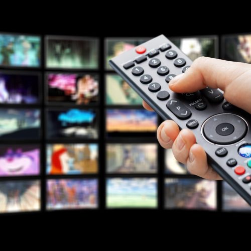 Multimedia television screen and human hand with remote controller Multimedia television screen and human hand with remote controller